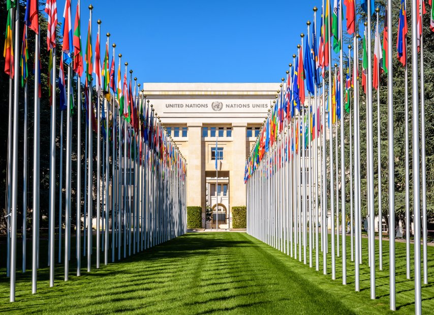 Avenue of flags and Palace of Nations in Geneva, Switzerland.